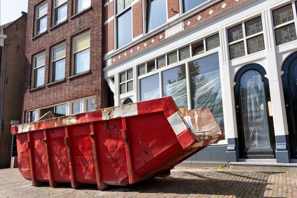 Red industrial Skip Outside Building